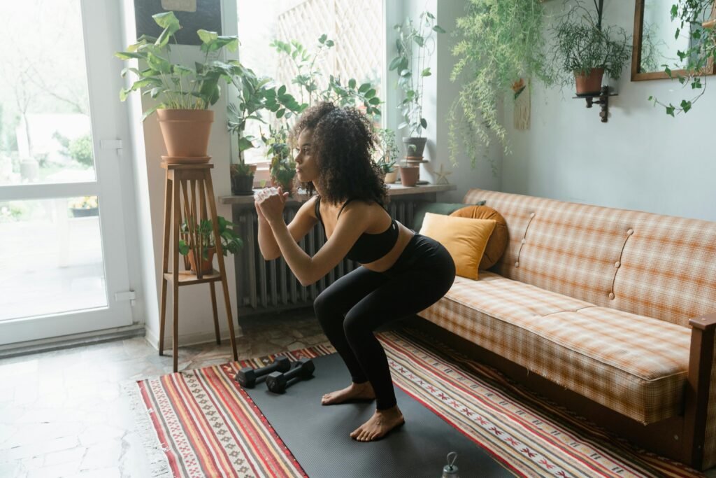 Woman doing squats in her living room
