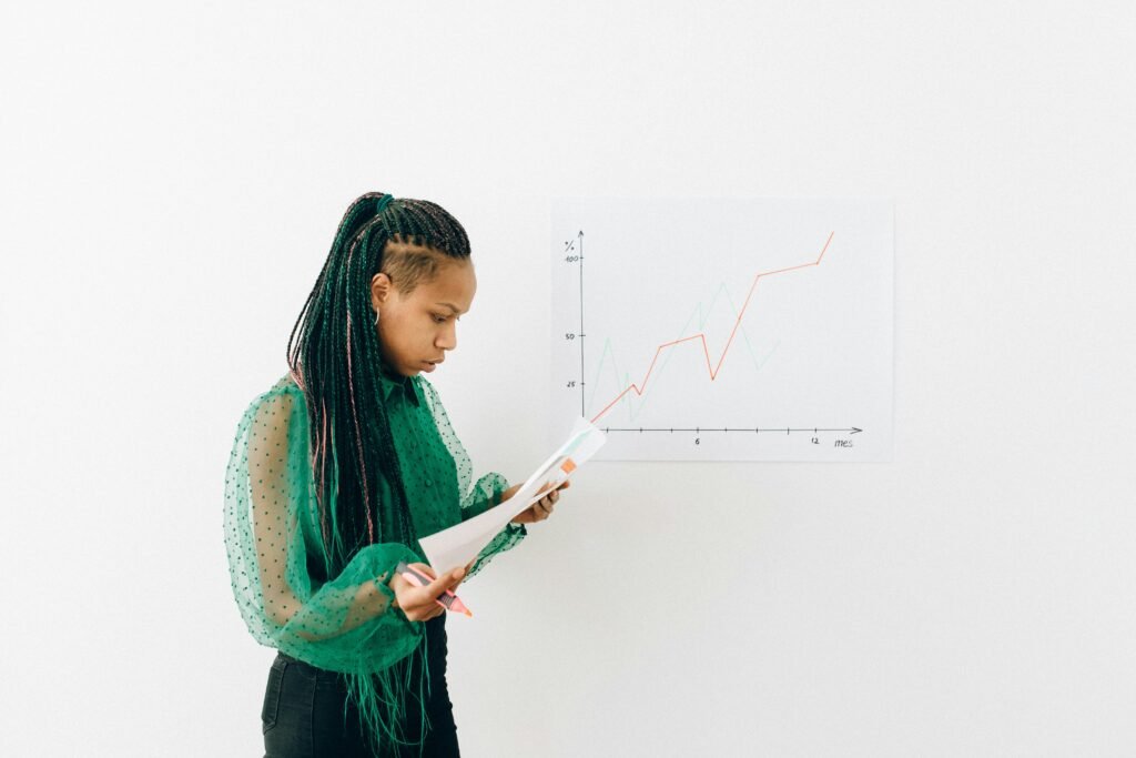 Woman in front of graph with upward trend