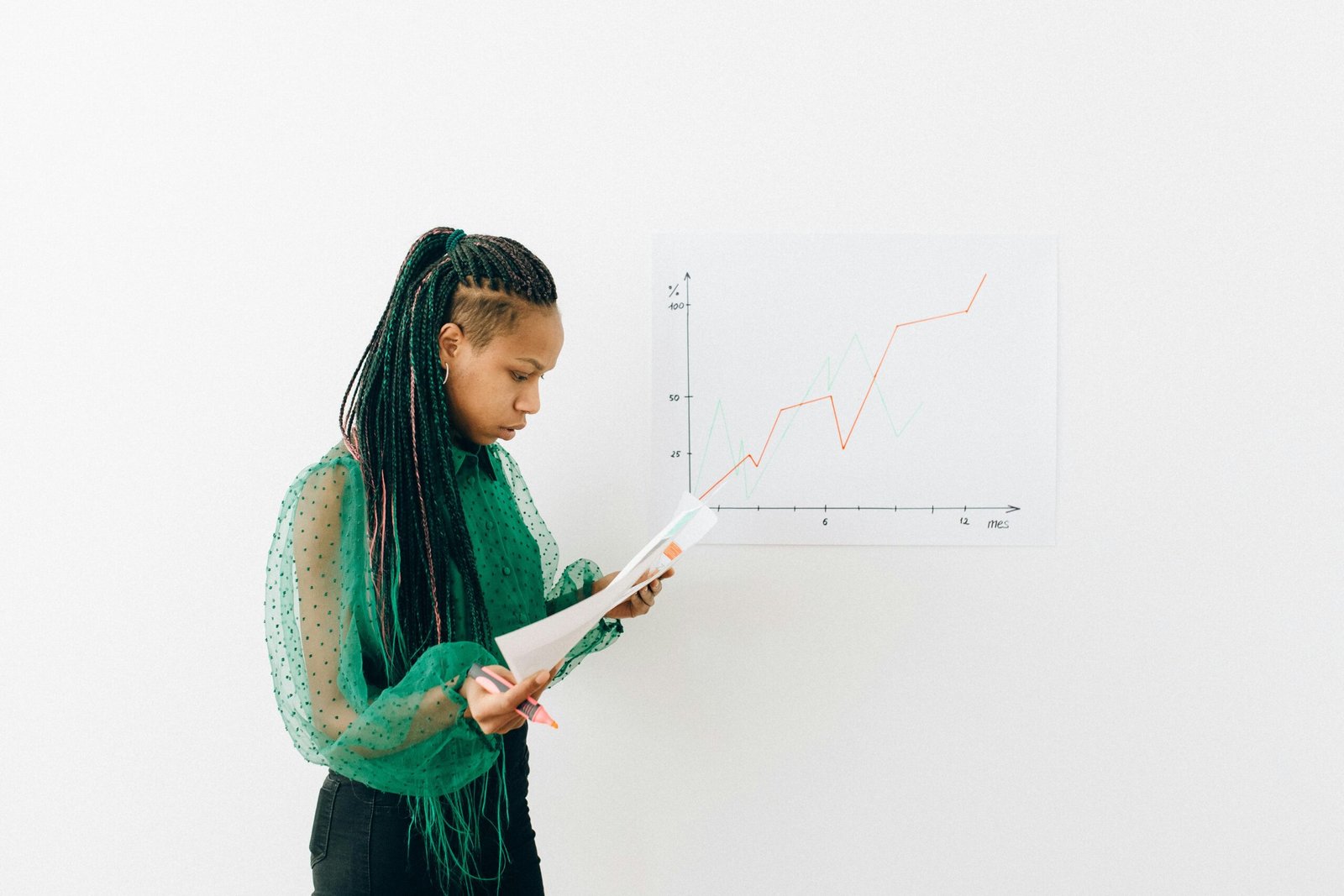 Woman in front of graph with upward trend